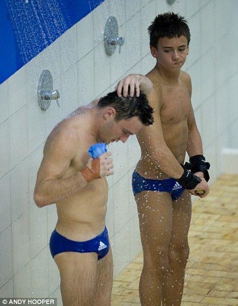 Gay men taking a shower together