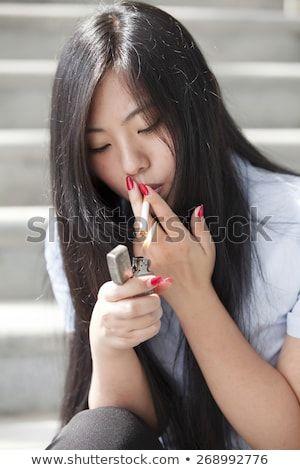 Asian chick smoking