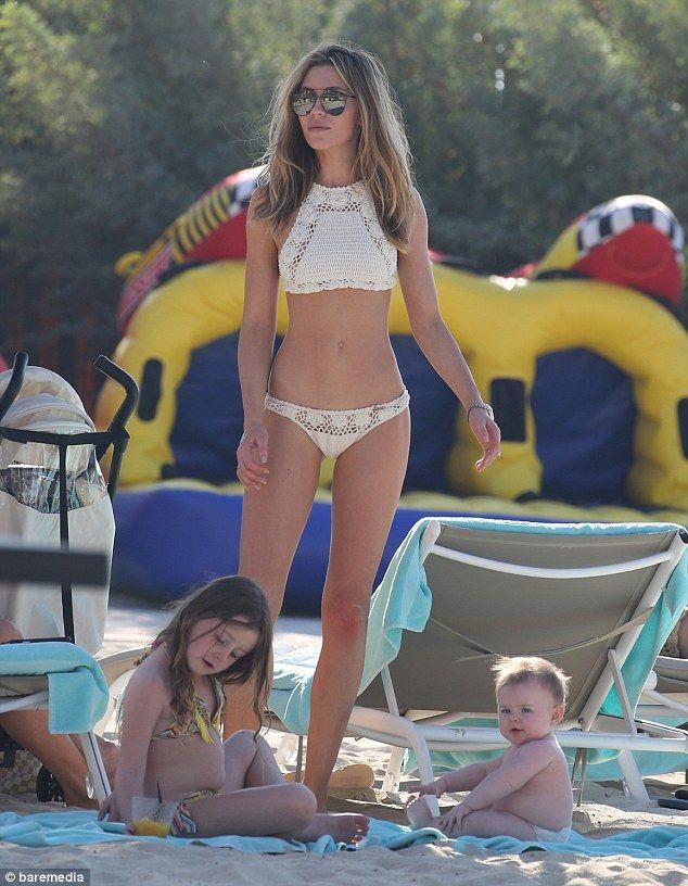 Mother daughter in micro bikinis